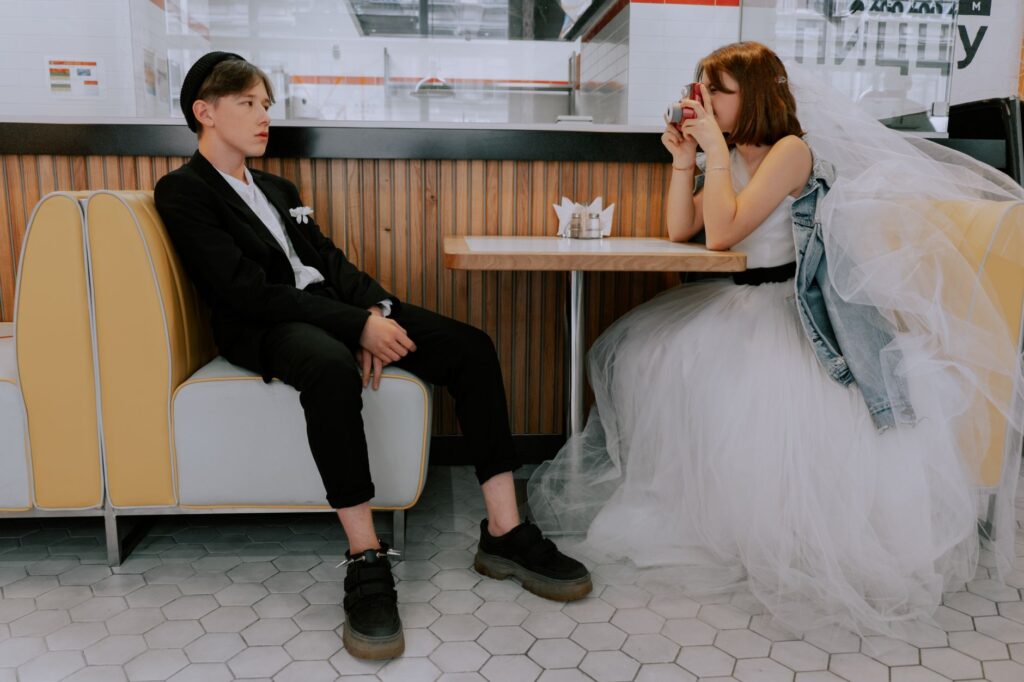 Couples enjoying an interactive photo booth at a wedding. — Las Vegas wedding trends 2026