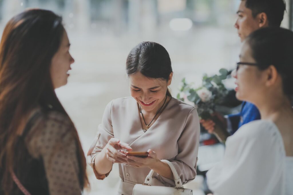 Guests engaging in interactive elements at a wedding, showcasing modern technology in action. — Las Vegas wedding trends…