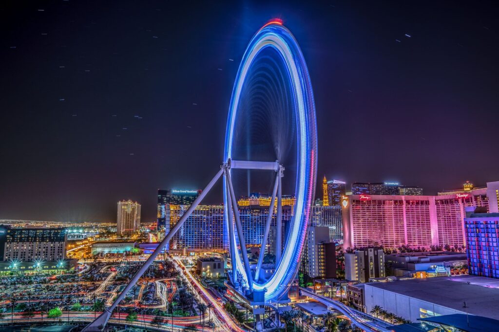 A breathtaking view of the High Roller Observation Wheel lit up at night. — unique wedding venues Las Vegas