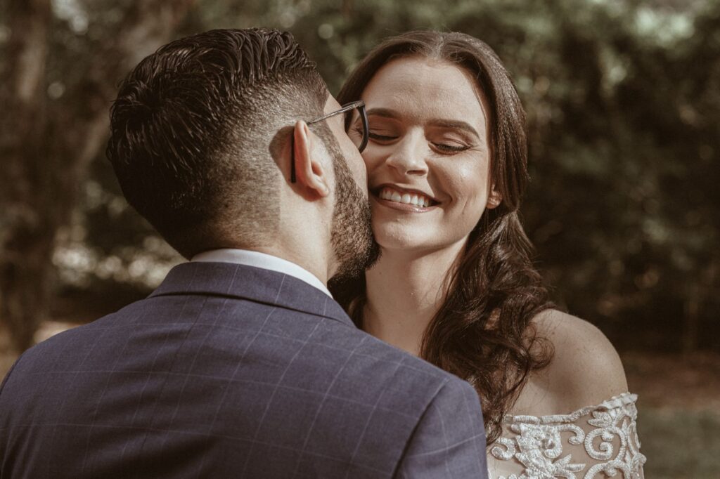 A candid shot of a couple laughing during their wedding ceremony, emphasizing joy and emotion. — best wedding photograph…