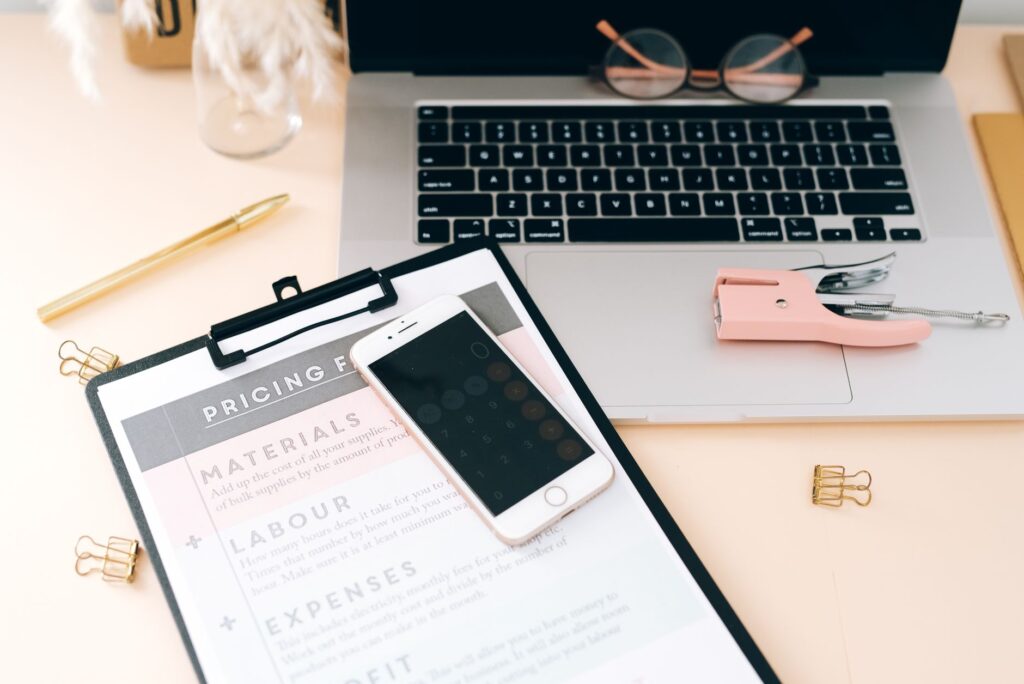A close-up of wedding planning tools and documents on a desk. — wedding planner Las Vegas