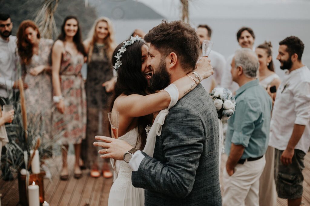 A couple celebrating their wedding with a small group of friends at a scenic location. — Las Vegas wedding package