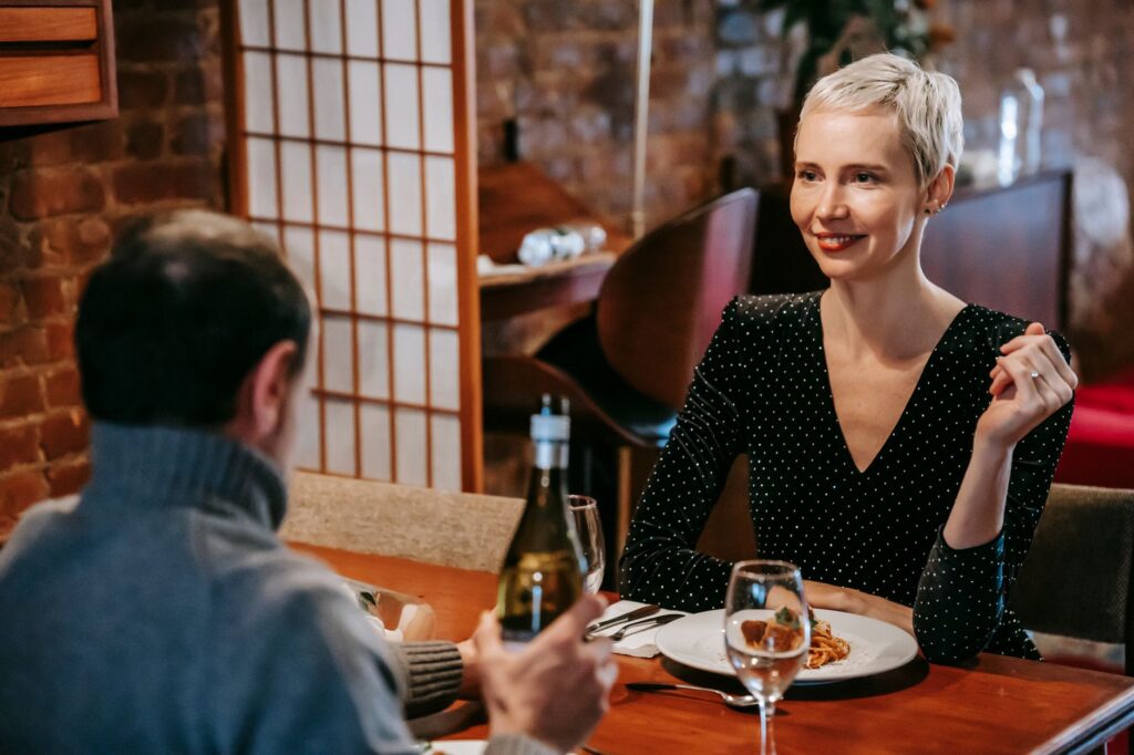 A couple during their rehearsal dinner at a stylish restaurant in Las Vegas. — Las Vegas wedding planning checklist