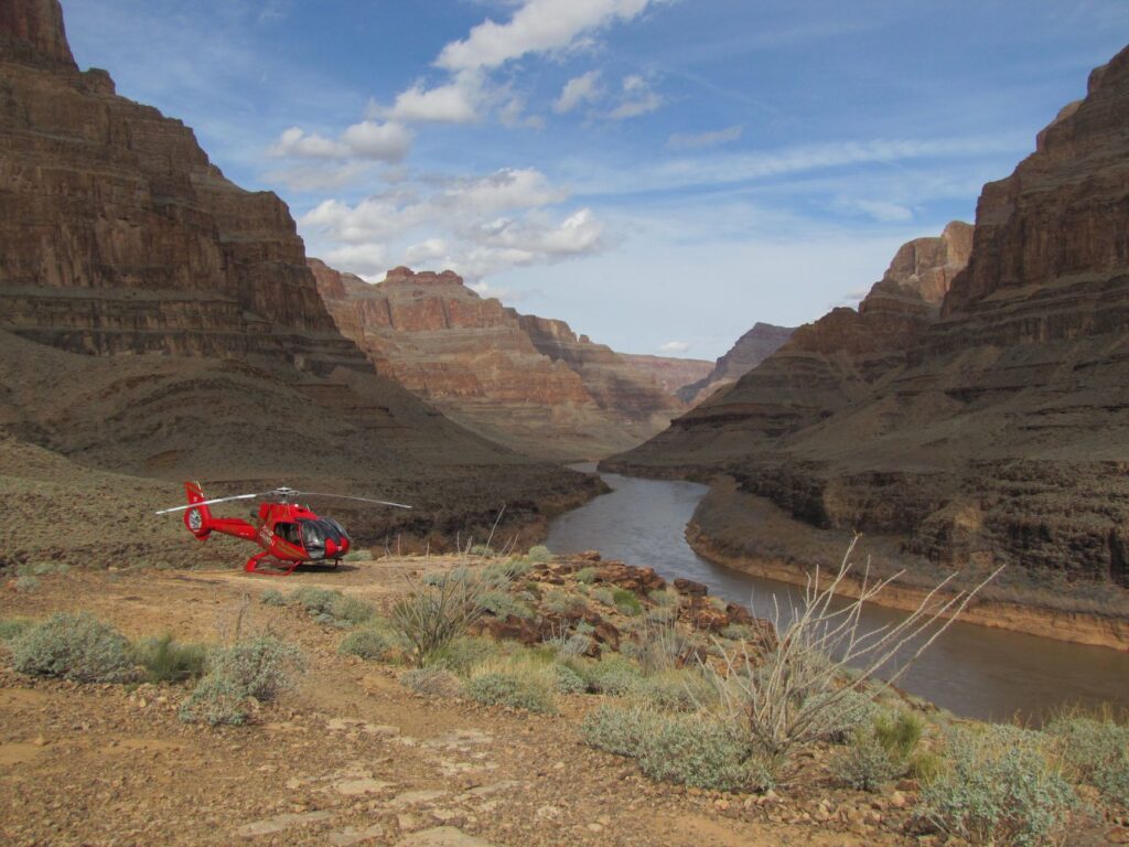 A couple enjoying a helicopter tour over the Grand Canyon, capturing the adventure aspect of their Las Vegas elopement.
