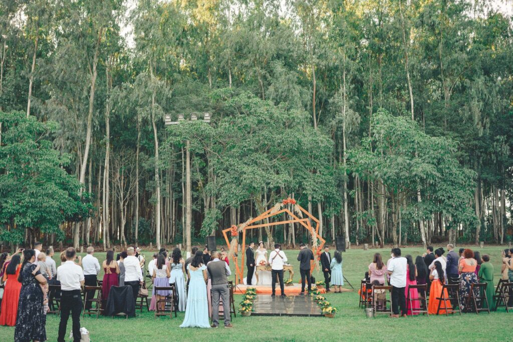 A couple exchanging vows in a stunning, eco-friendly venue surrounded by lush greenery. — Las Vegas wedding trends 2026
