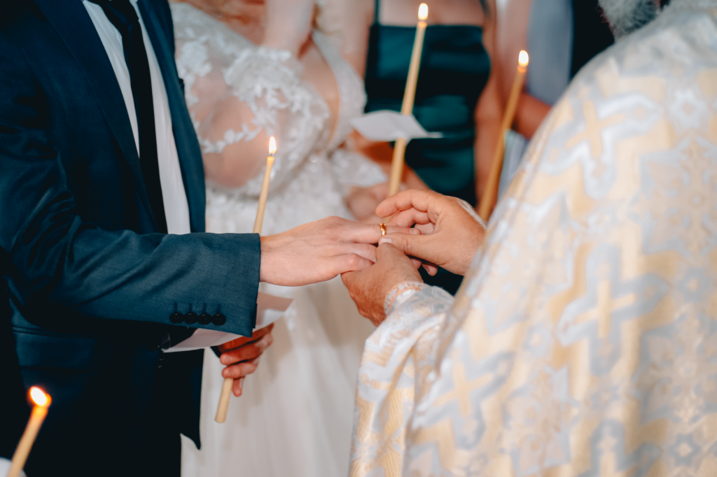A couple exchanging vows in front of a Las Vegas chapel, showcasing the romantic atmosphere of a Las Vegas elopement.