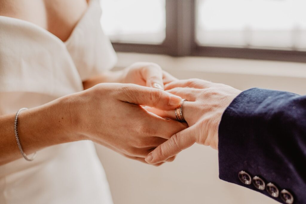 A couple happily exchanging vows in front of the iconic Las Vegas Strip — Las Vegas wedding packages