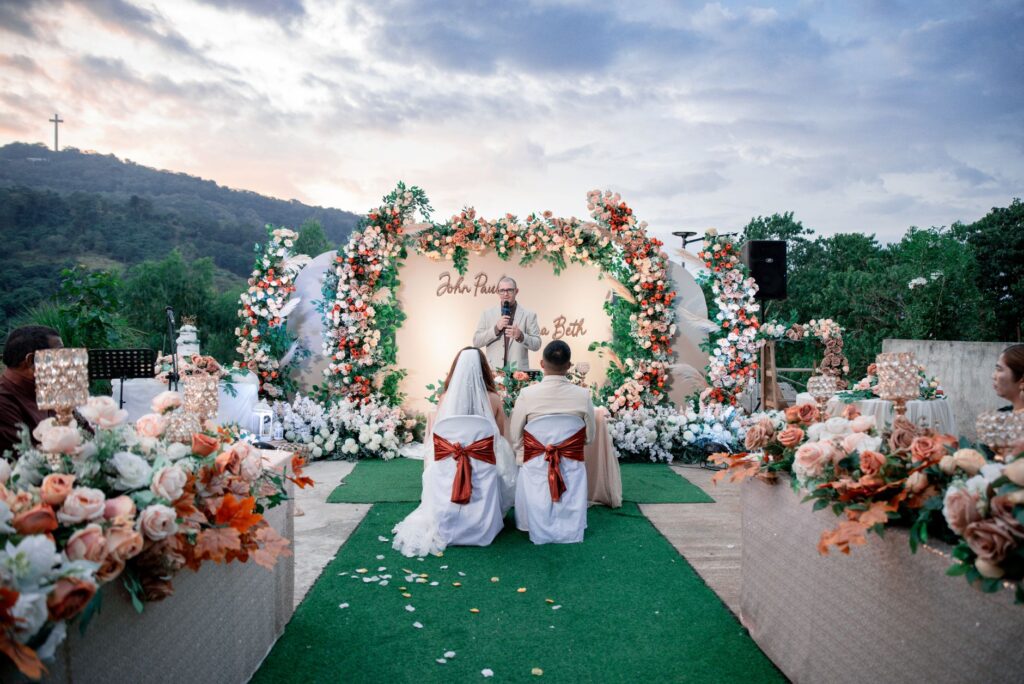 A couple sharing their vows in a picturesque eco-friendly setting surrounded by greenery. — eco-friendly wedding Las Vegas