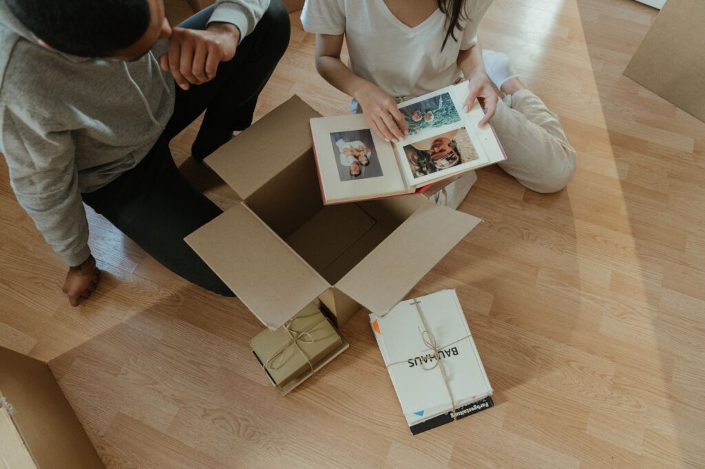 A couple viewing their wedding album with joy — Las Vegas wedding photographers