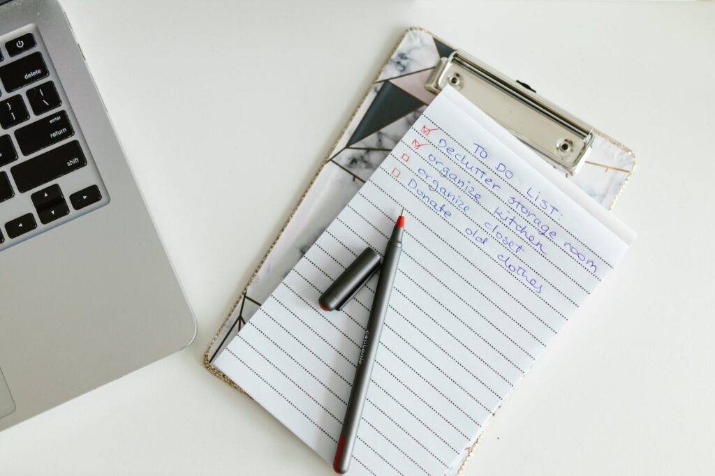 A detailed wedding to-do list on a clipboard with a scenic Las Vegas backdrop. — Las Vegas wedding planning checklist
