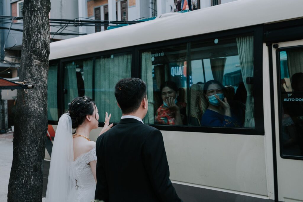 A group of wedding guests boarding a shuttle bus, highlighting the convenience of guest shuttle service. — las vegas wed…