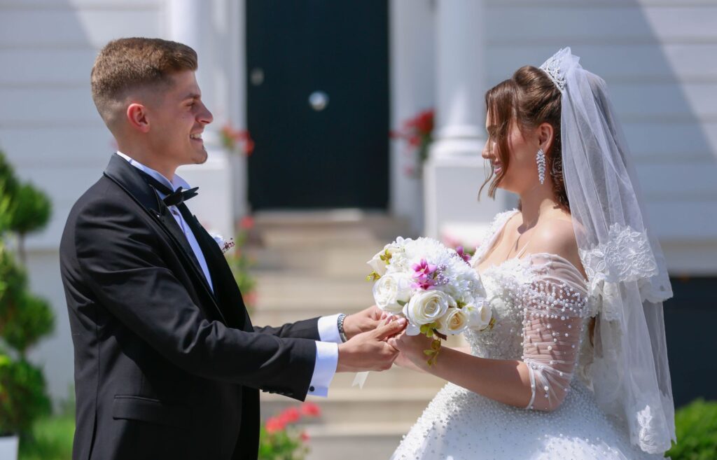 A happy couple exchanging vows in front of a classic Las Vegas wedding chapel. — stress-free elopement Las Vegas