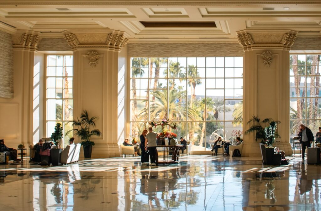 A happy group of wedding guests checking into a hotel. — las vegas wedding hotel blocks