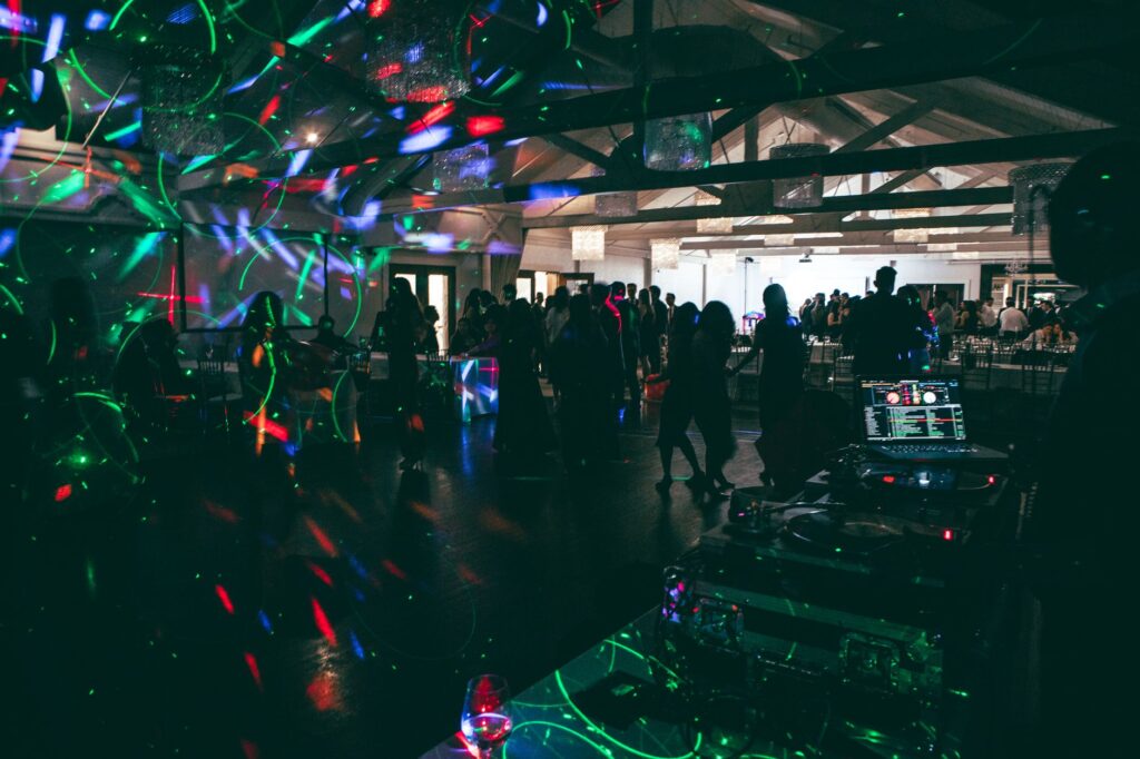 A lively DJ booth with guests dancing at a Las Vegas wedding. — Las Vegas wedding vendors
