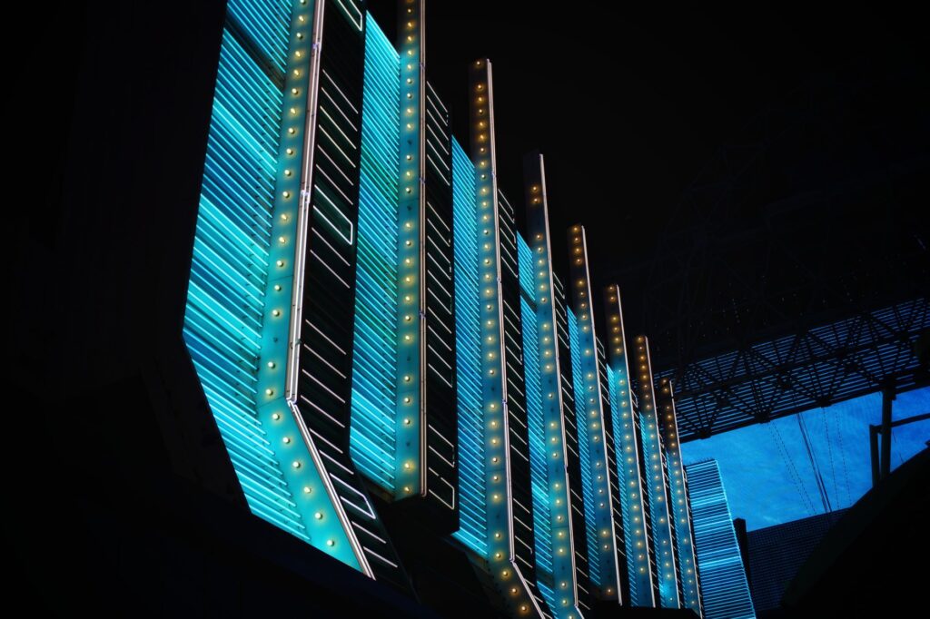A romantic shot of a couple at a Las Vegas chapel with neon lights. — Las Vegas elopement guide