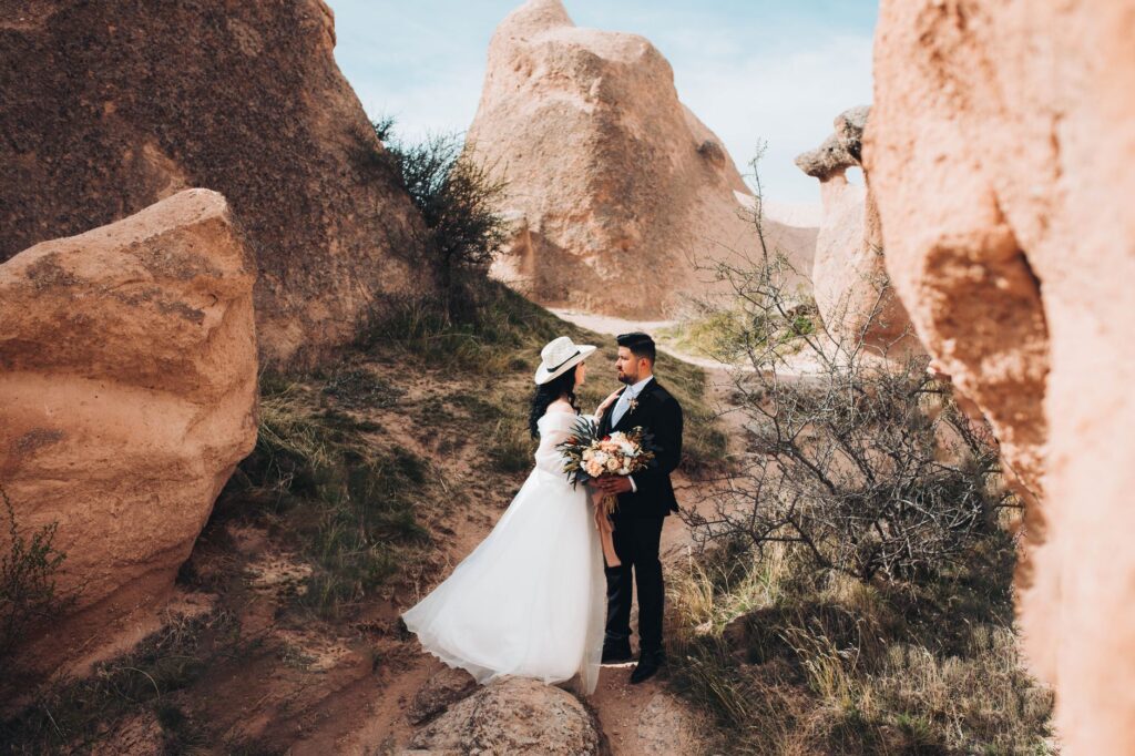 A scenic shot of Red Rock Canyon with a wedding ceremony taking place amidst the rocks. — unique wedding venues Las Vegas