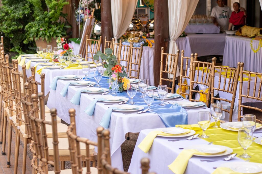 A stunning outdoor wedding venue in Las Vegas featuring beautiful catering setups and photographers capturing the day. —…