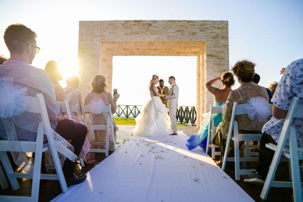 A vibrant summer wedding ceremony with guests enjoying the sunshine — best time to marry in Las Vegas