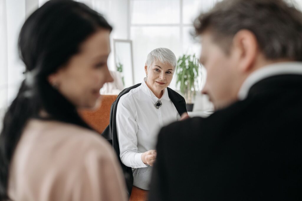 A wedding planner consulting with a couple at a cafe in Las Vegas. — wedding planner Las Vegas