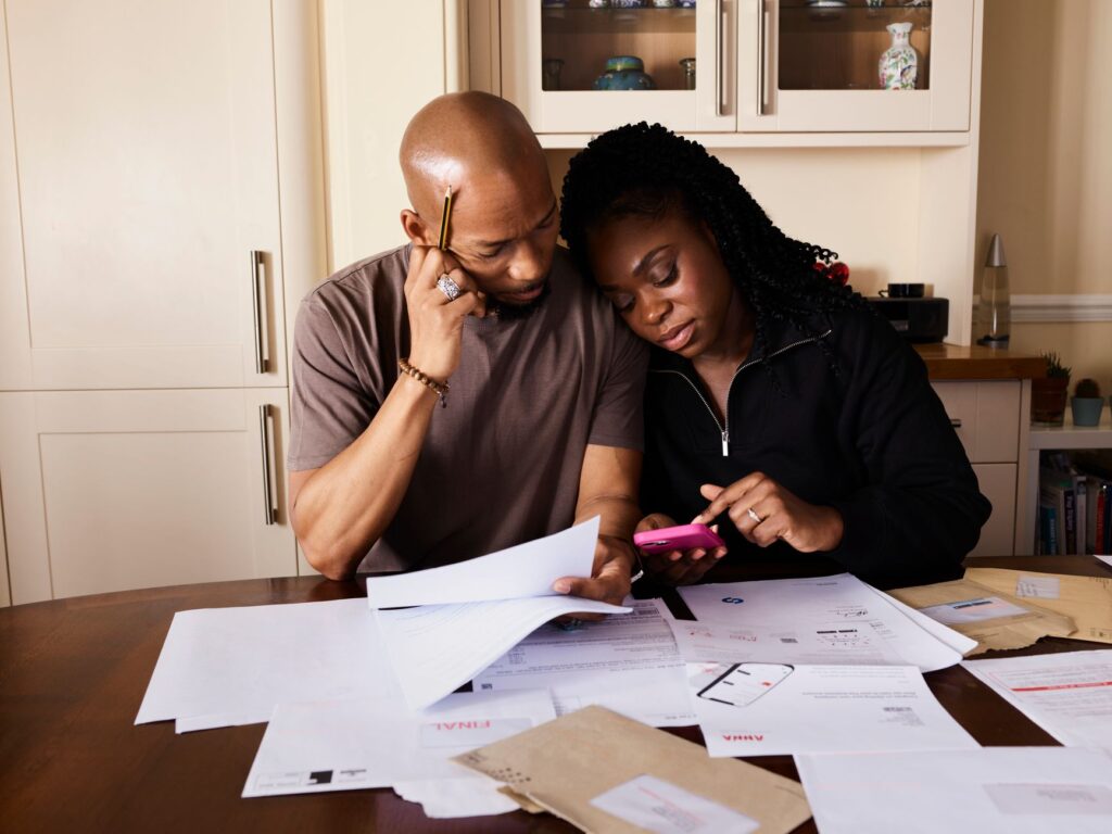 A wedding planner discussing budget plans with a couple. — questions to ask wedding planner Vegas