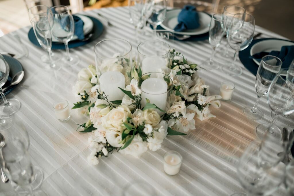 An elegant wedding reception table adorned with flowers and candles. — Las Vegas wedding package