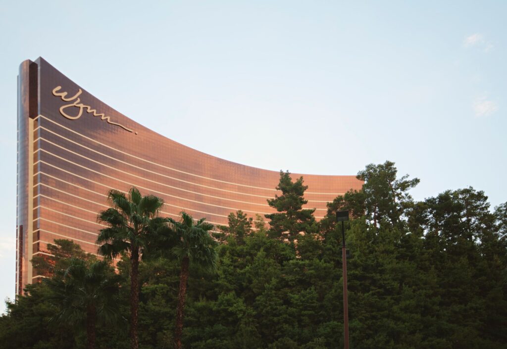 An exterior shot of Wynn Las Vegas with its iconic architecture and manicured gardens. — luxury wedding venues Las Vegas