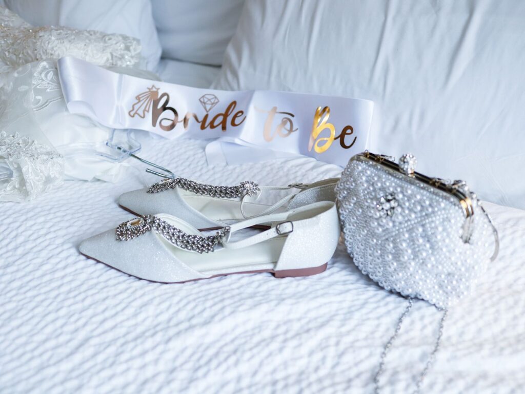 Bridal attire laid out on a bed, showcasing essential items for the wedding day. — destination wedding packing list