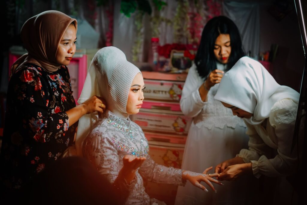 Bridal party preparing for the ceremony, capturing moments of makeup and hair. — wedding day timeline