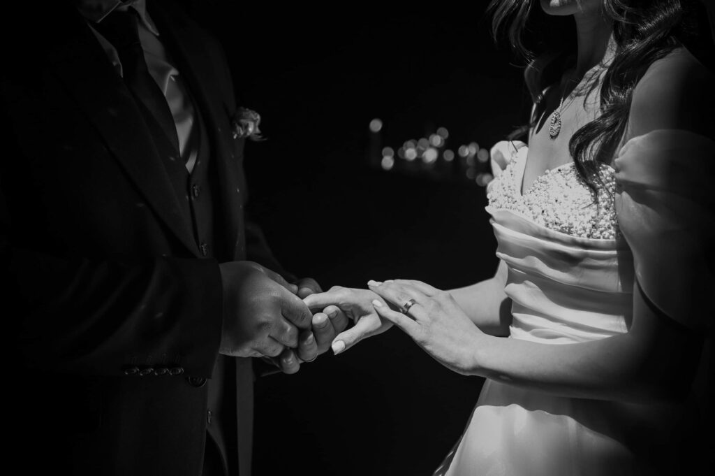 Couples exchanging vows at a classic Vegas chapel, with neon lights in the background. — Vegas wedding checklist