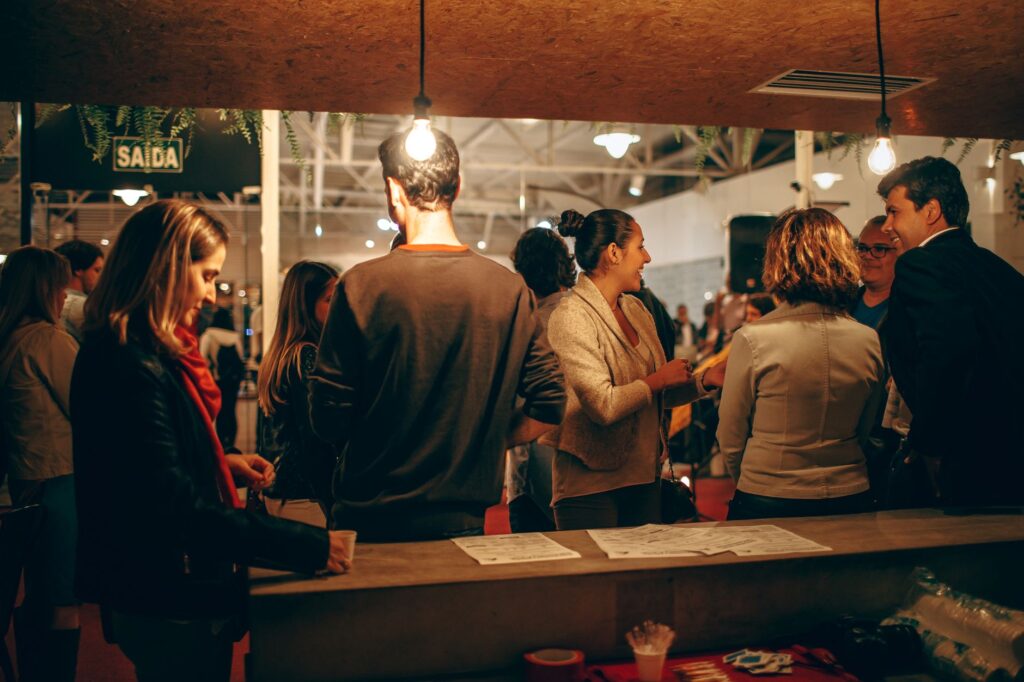 Happy couples networking with vendors at a Las Vegas wedding expo, exchanging ideas and contact information. — Las Vegas…