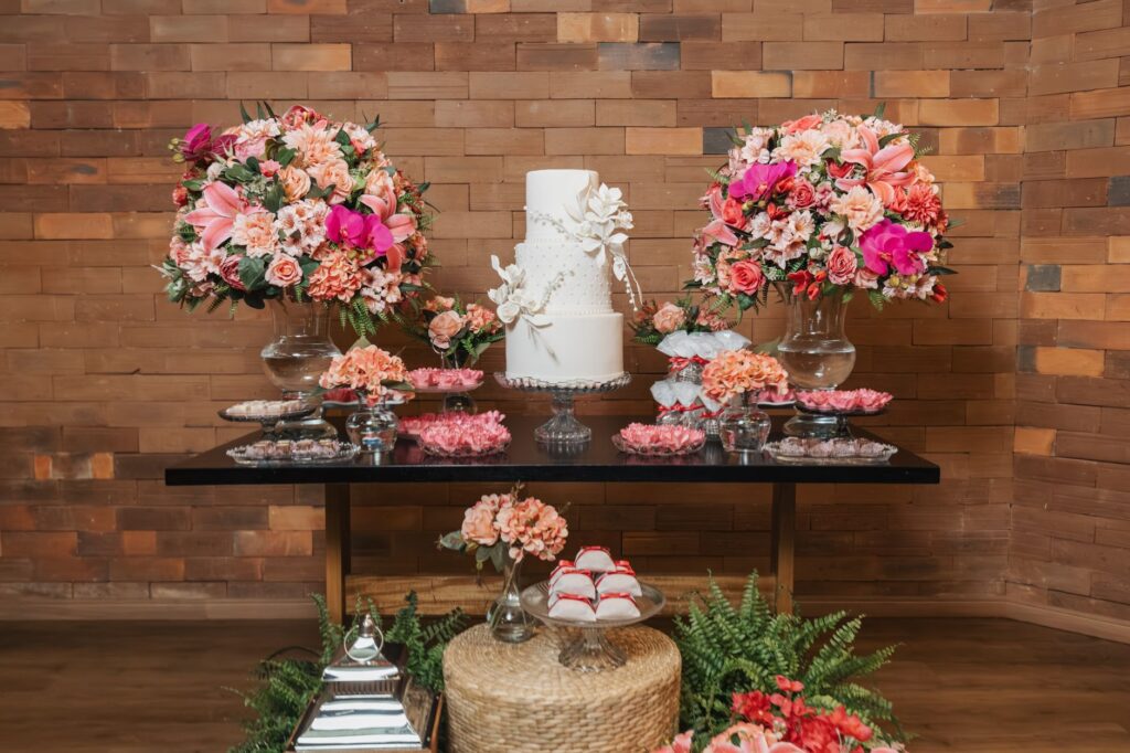 A beautifully arranged elopement package including flowers, a cake, and a wedding dress. — Las Vegas elopement planning
