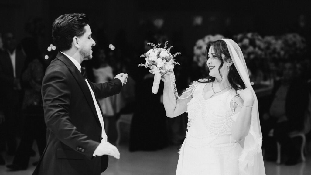 A candid moment of the couple laughing during their first dance, capturing genuine emotions. — Las Vegas wedding photogr…