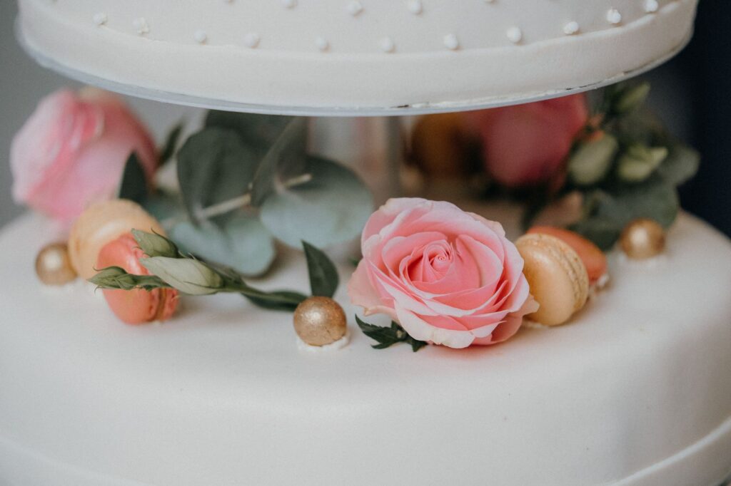 A close-up of a beautifully designed wedding cake inspired by Las Vegas culture. — Las Vegas wedding culture