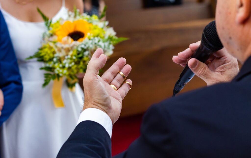 A close-up of a licensed wedding officiant smiling while preparing to conduct a ceremony. — Las Vegas wedding officiant