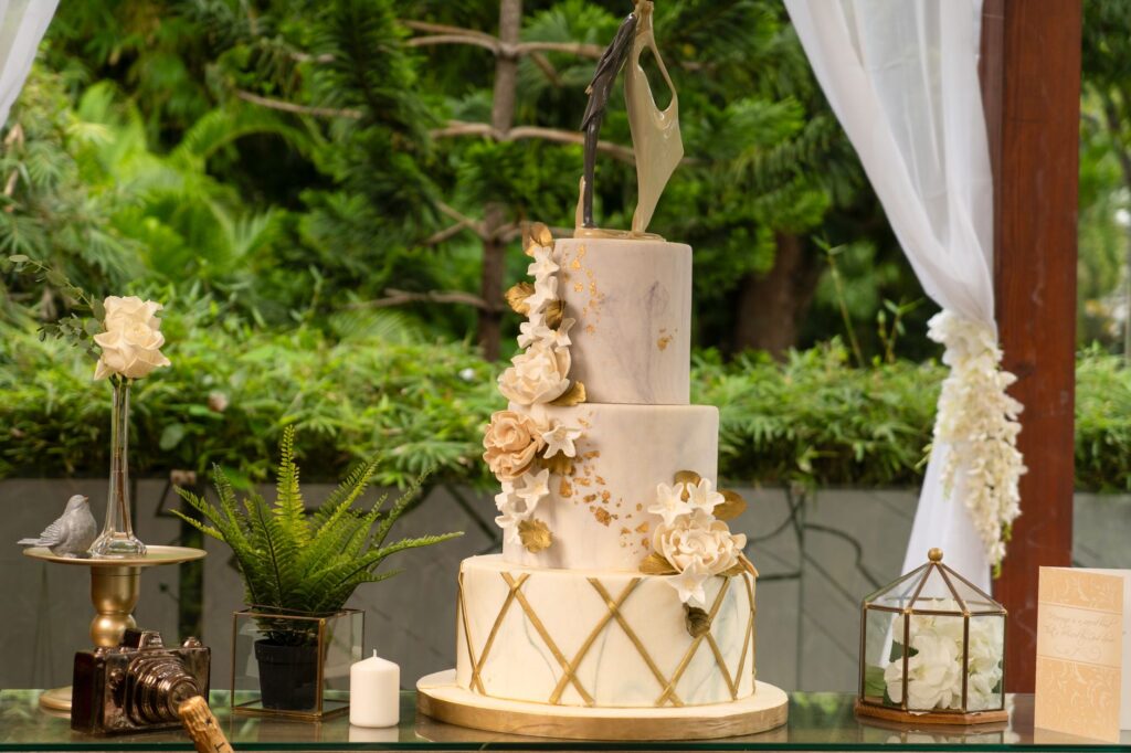 A close-up of a wedding cake decorated with Las Vegas-themed designs. — Las Vegas destination weddings