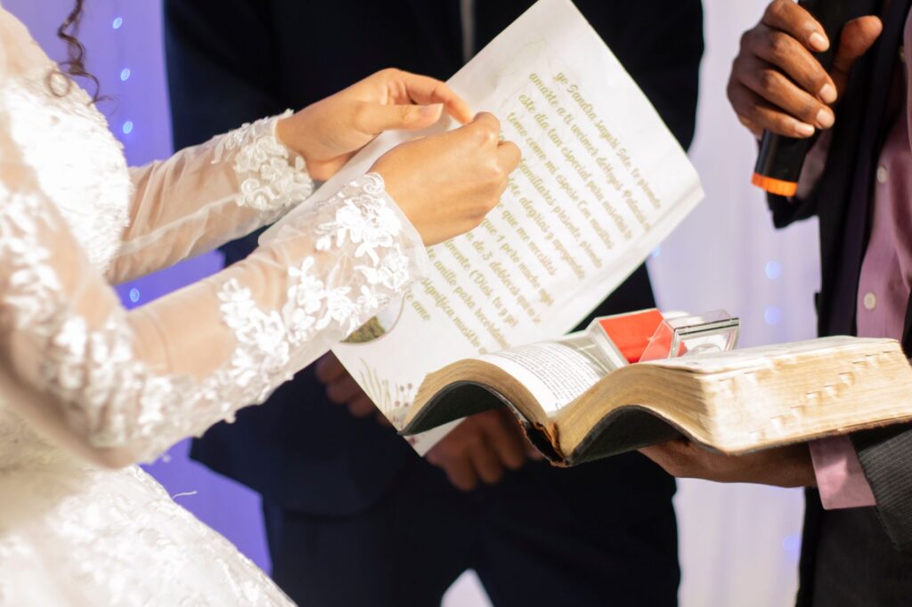 A close-up of a wedding planner and couple discussing ideas with wedding samples laid out. — Las Vegas wedding planner