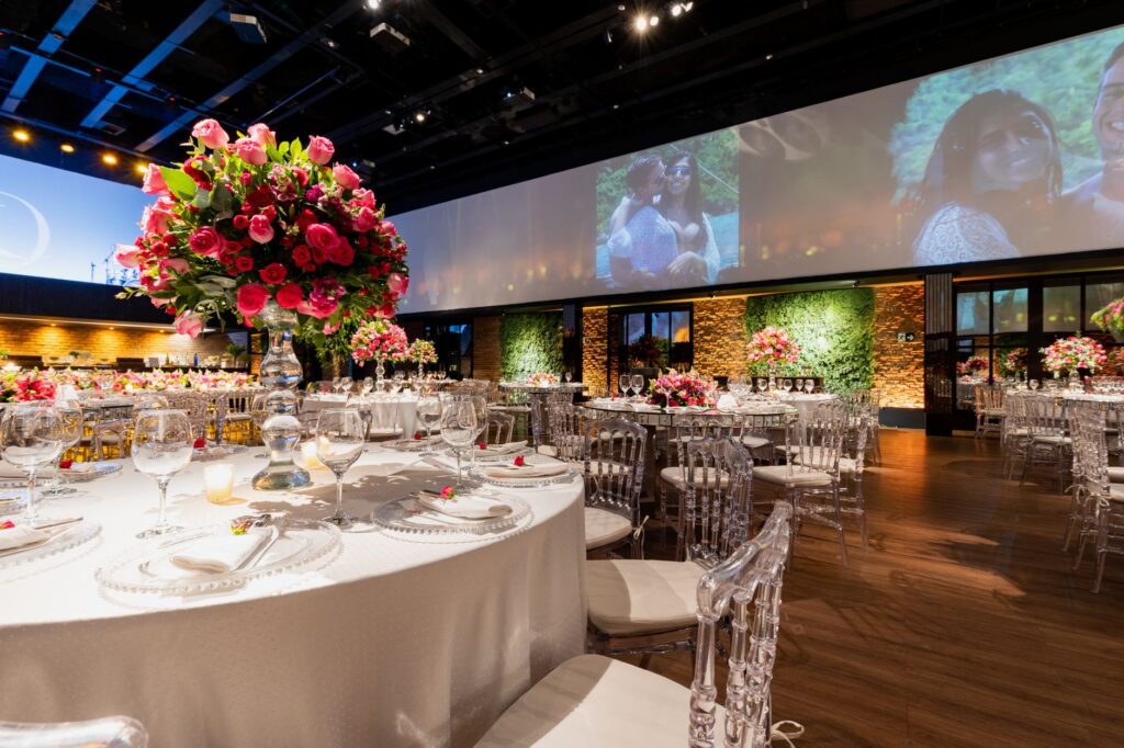 A close-up of wedding decor at a venue, highlighting floral arrangements and table settings. — questions for wedding venue