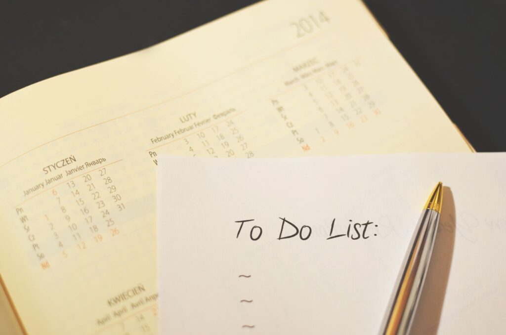 A close-up of wedding planner tools like calendars and checklists. — Las Vegas wedding planner guide