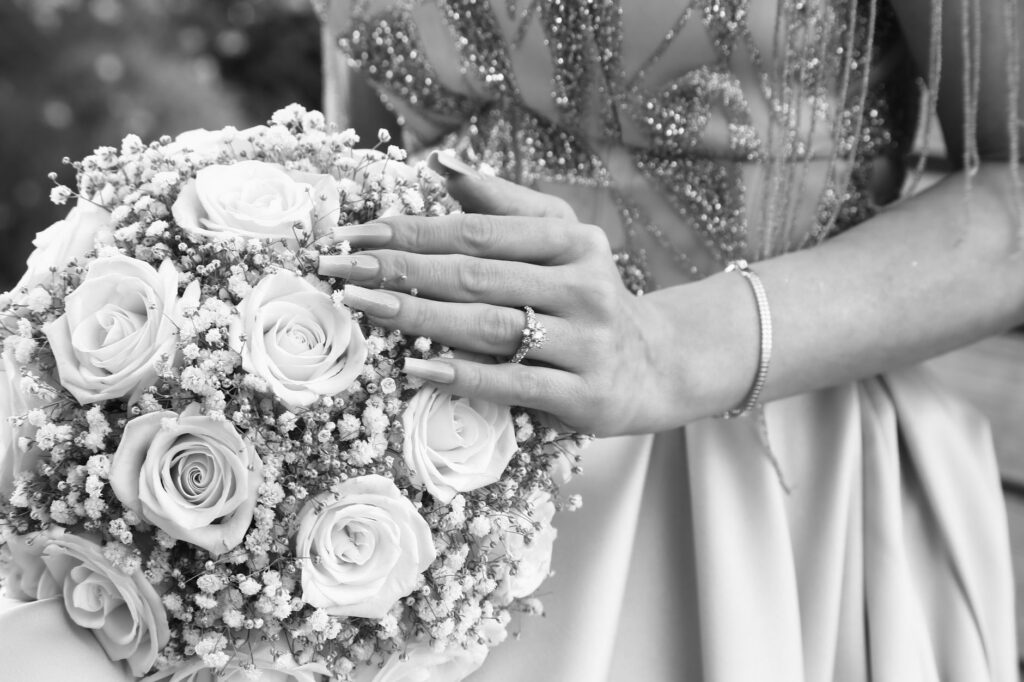 A close-up of wedding rings and flowers, highlighting the artistic style of wedding photography. — Las Vegas wedding pho…