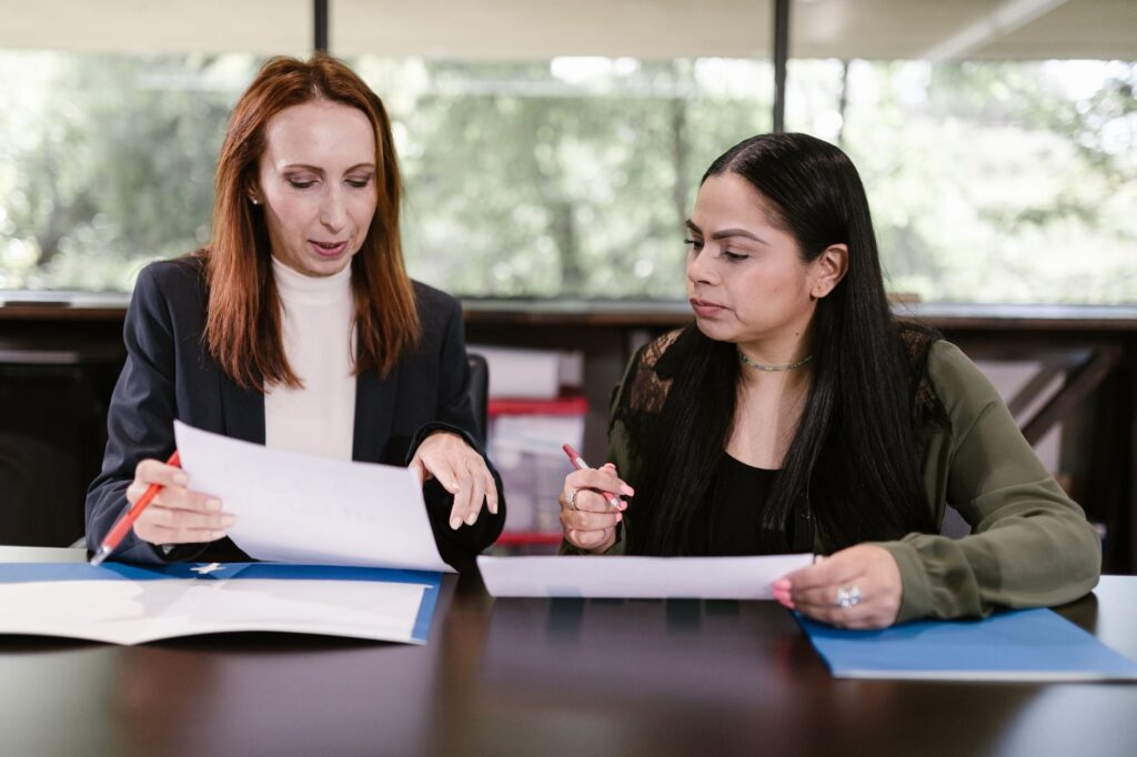A couple consulting with a wedding planner at a meeting. — Las Vegas wedding planner guide