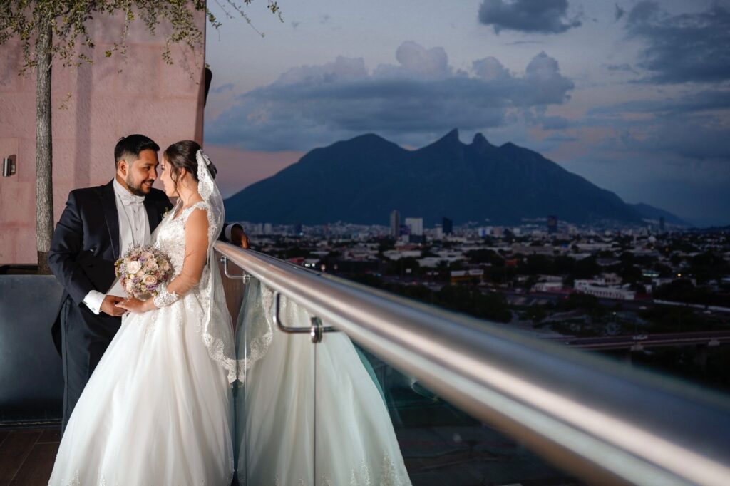 A couple enjoying a sunset wedding in Las Vegas, highlighting the city's skyline. — best time to marry in Las Vegas