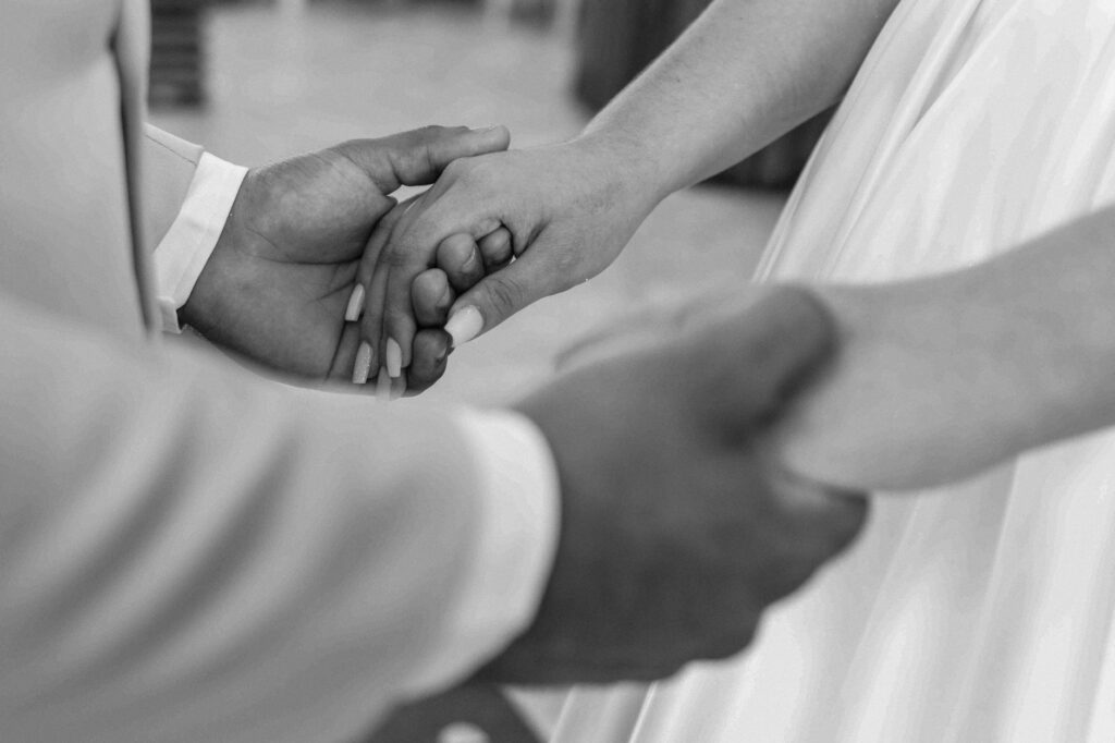 A couple exchanging vows at The Little White Chapel, capturing an intimate moment. — Las Vegas wedding venues