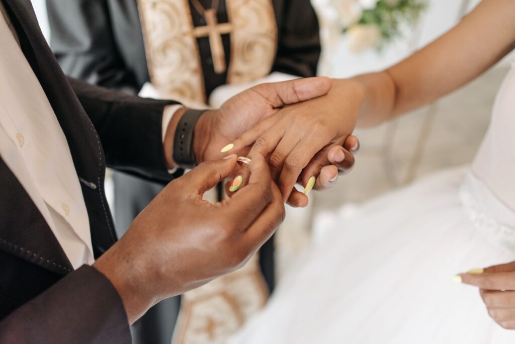 A couple exchanging vows in a Las Vegas chapel with an officiant. — Las Vegas wedding packages