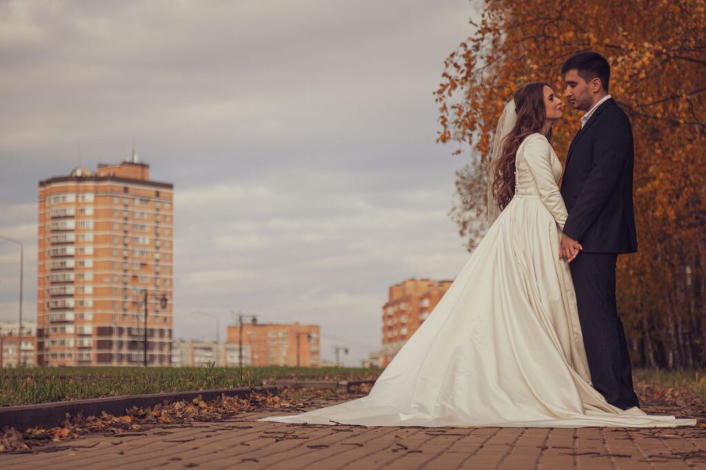 A couple exchanging vows in front of a Las Vegas skyline backdrop. — Las Vegas wedding checklist