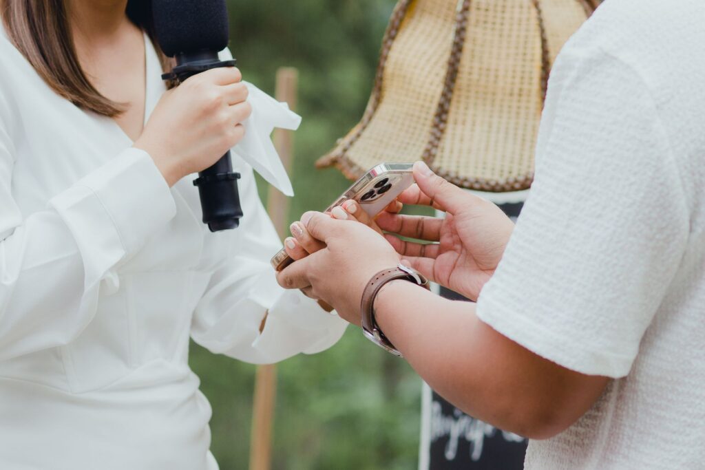 A couple using technology, like a drone or live streaming, during their wedding ceremony. — Las Vegas wedding trends 2026