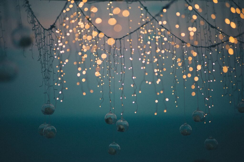 A creative DIY backdrop made from fabric and fairy lights for wedding photos. — DIY wedding decor Las Vegas