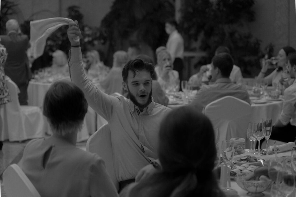 A festive reception with guests enjoying traditional Las Vegas cuisine. — Las Vegas wedding traditions