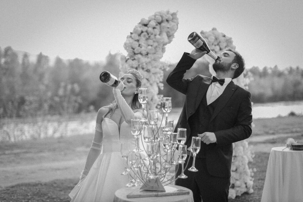 A happy couple celebrating their elopement with a celebratory toast in a luxury hotel. — Las Vegas elopement planning