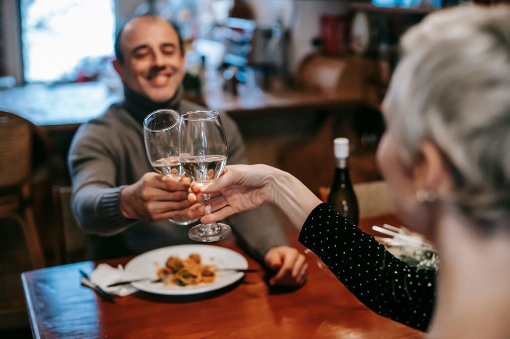 A happy couple celebrating their elopement with a romantic dinner at a rooftop restaurant. — Las Vegas elopement planning