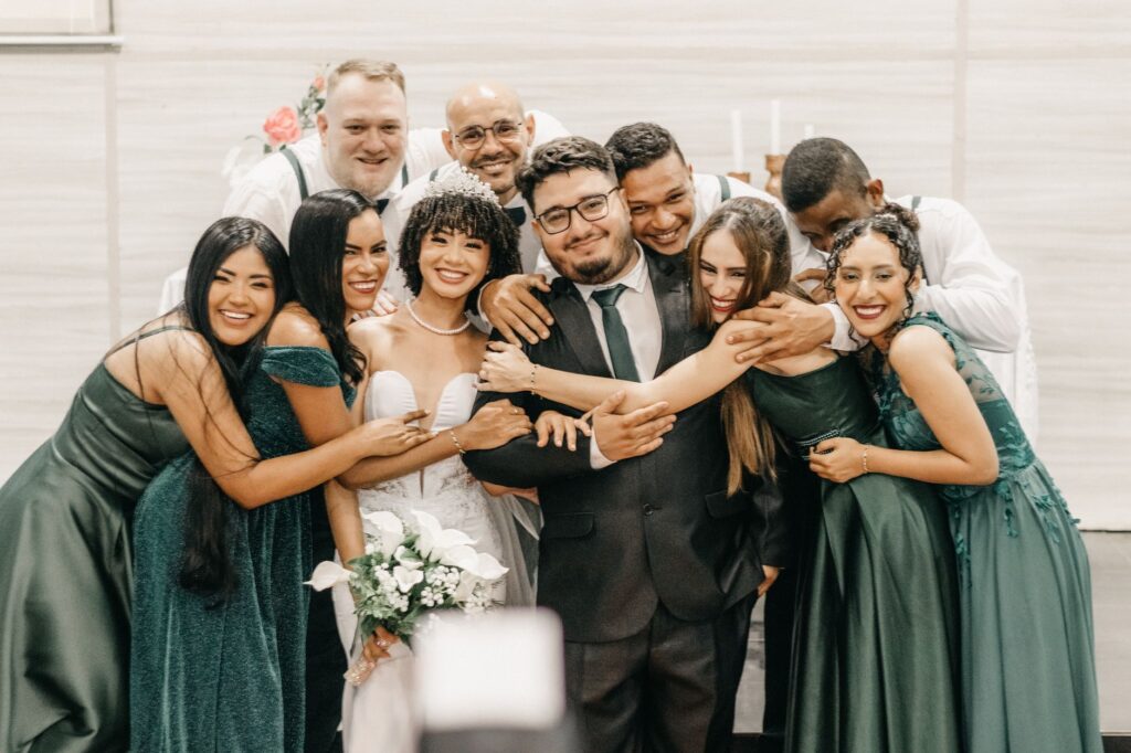 A happy couple posing with family and friends during their Las Vegas wedding — affordable wedding packages Las Vegas